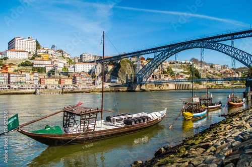 Old Porto cityscape skyline, traditional boats with wine barrels and Douro River in Porto, Portugal photo