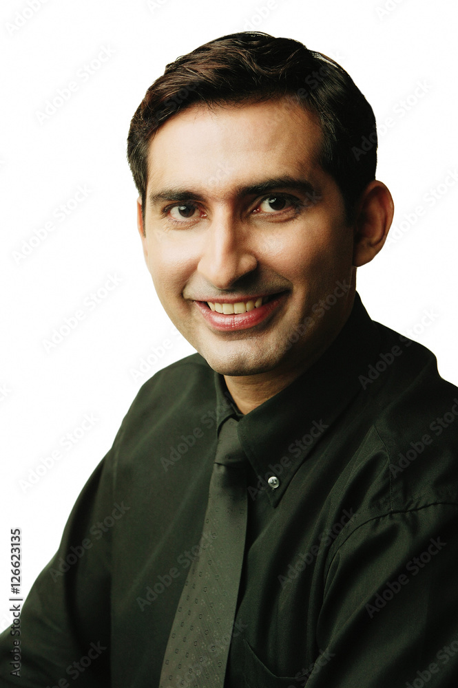 Obraz premium Executive looking at camera, smiling