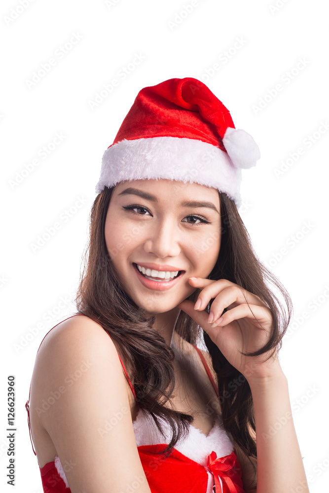 Christmas Woman. Beauty Asian Model Girl in Santa Hat isolated o Christmas Woman. Beauty Asian Model Girl in Santa Hat isolated o