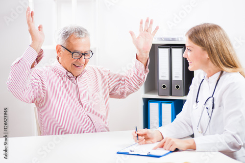 Slika na platnu Happy patient is getting ecstatic when he heard the news of successful treatment