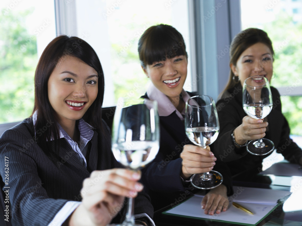 Three woman toasting the camera Three woman toasting the camera