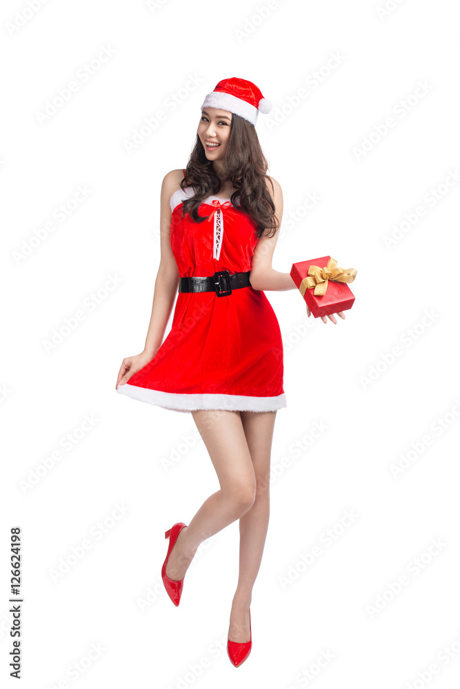 Full length portrait of a asian woman in santa claus cloth holdi Full length portrait of a asian woman in santa claus cloth holdi