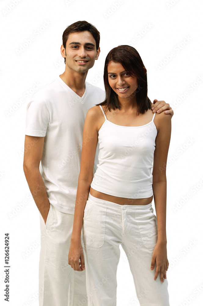 Couple standing side by side, looking at camera Couple standing side by side, looking at camera