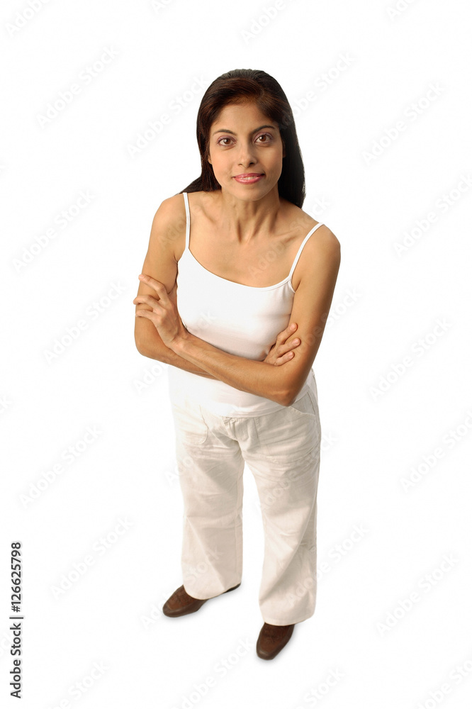 Woman standing, arms crossed, looking at camera Woman standing, arms crossed, looking at camera
