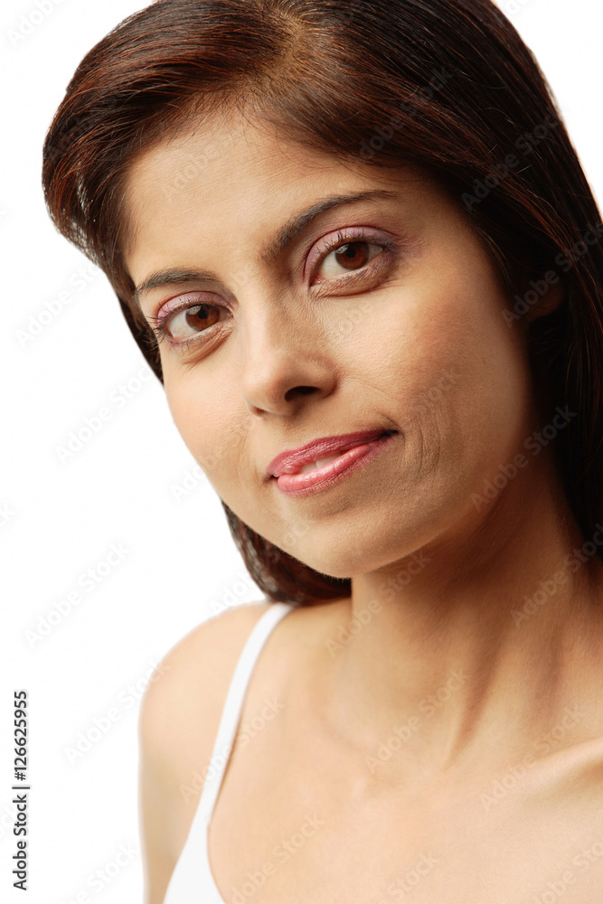 Fototapeta premium Woman looking at camera, head shot