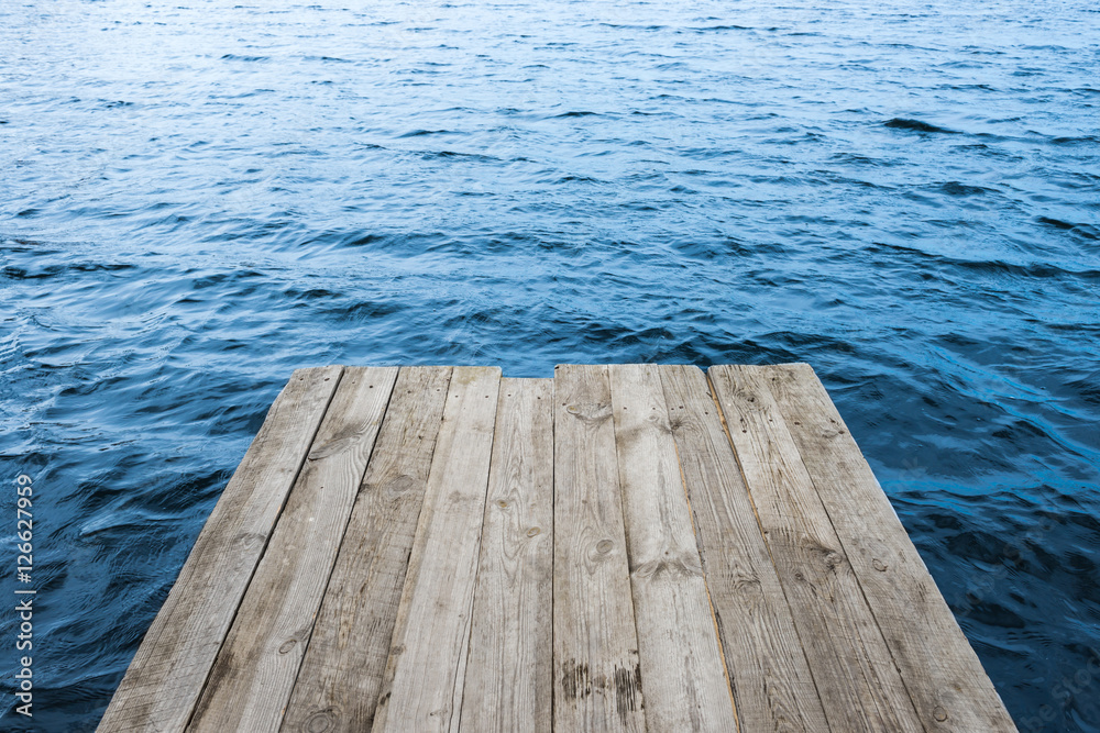 Blue water with empty wooden platform Blue water with empty wooden platform