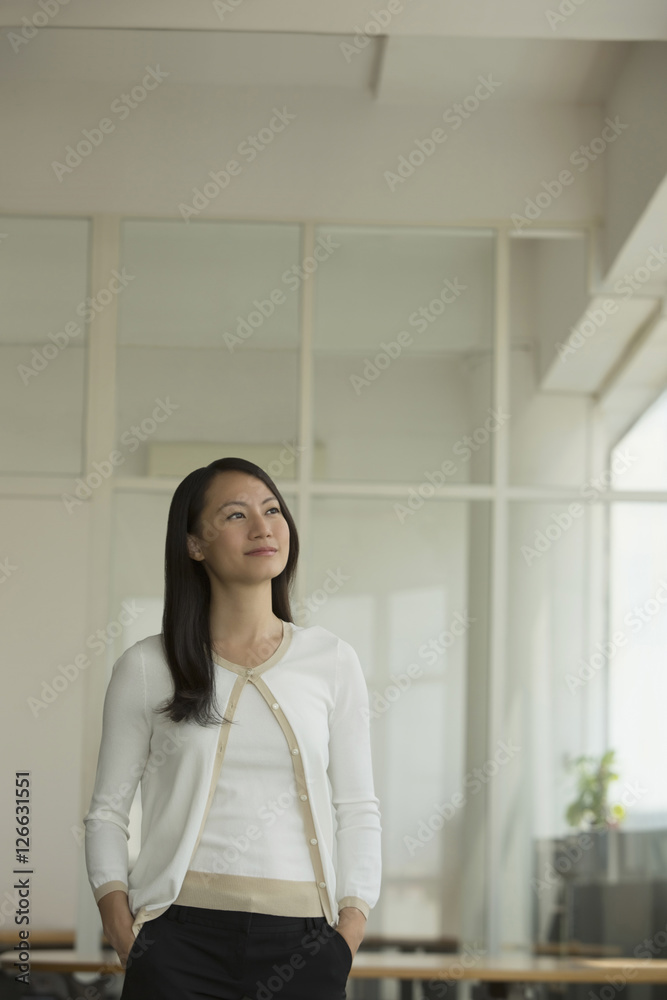 Singapore, Portrait of business woman in office Singapore, Portrait of business woman in office