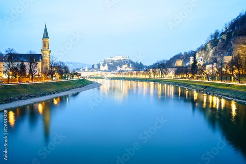 Evening cityscape over river on Salzburg