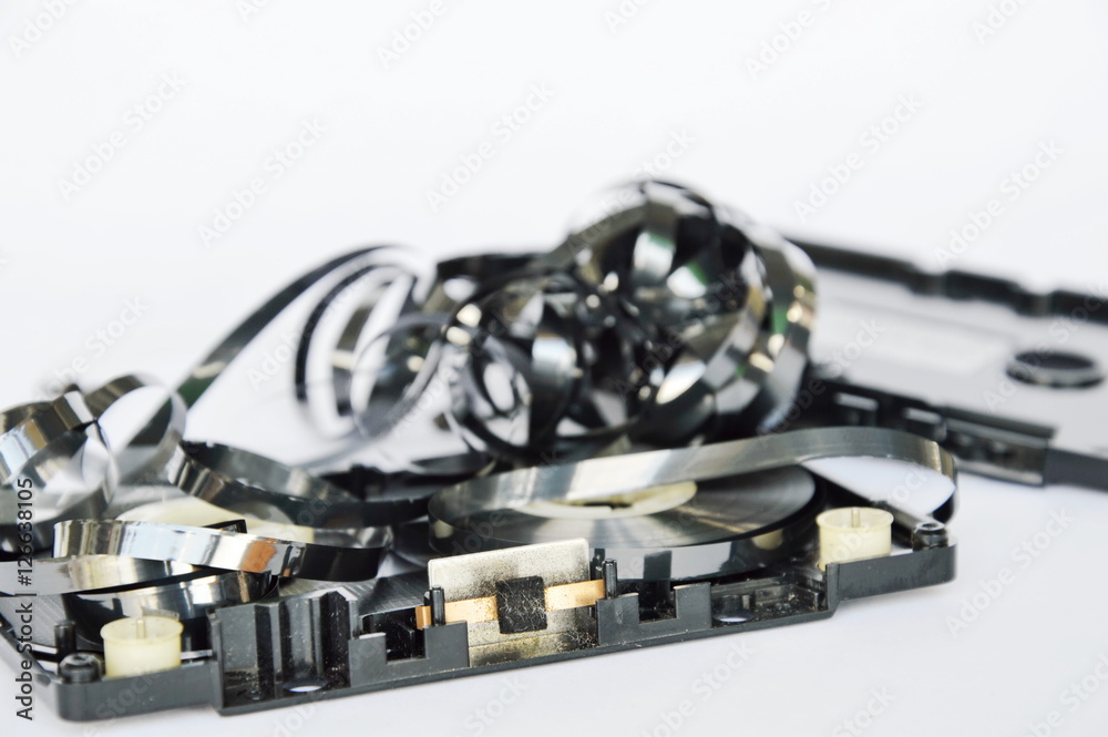 magnetic audio cassette tape roll on white background magnetic audio cassette tape roll on white background