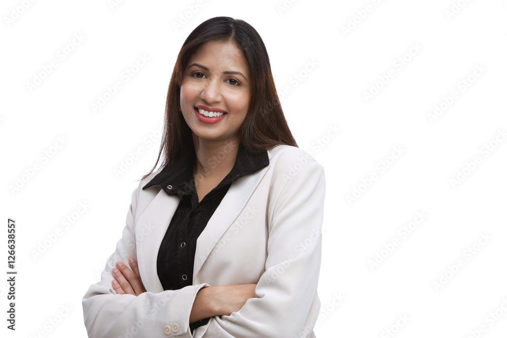 Businesswoman looking at camera, arms crossed Businesswoman looking at camera, arms crossed