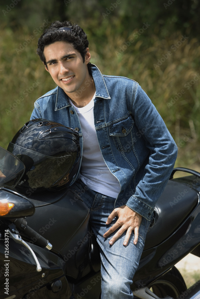 Young man riding motorbike