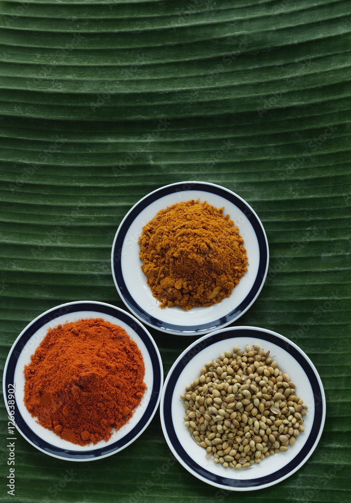 Still life of curry and masala powder on a banana leaf Still life of curry and masala powder on a banana leaf