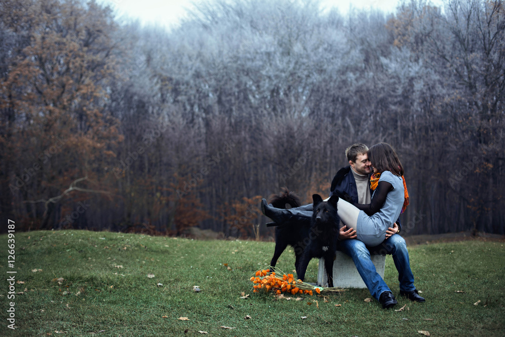 young couple spend free time with their dog young couple spend free time with their dog