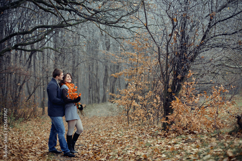 loving couple walking in the autumn forest © andriychuk