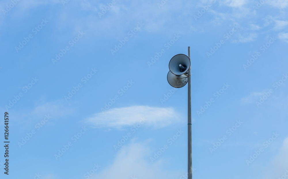 Horn speaker for public relations on blue sky background Horn speaker for public relations on blue sky background