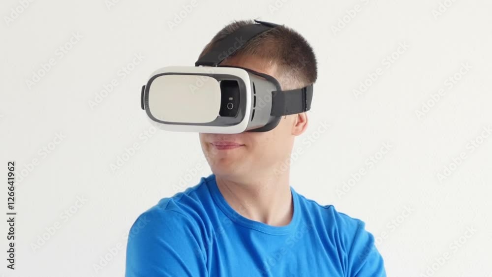 Man in a virtual reality mask looks around.
