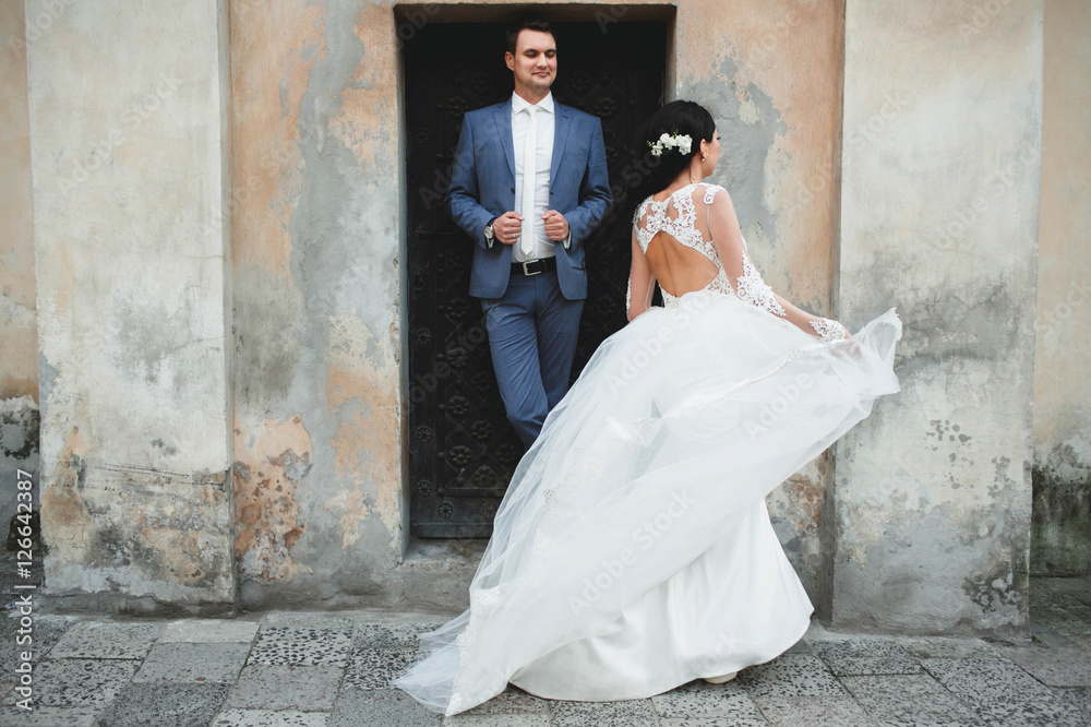 groom and bride exploring historical monuments groom and bride exploring historical monuments