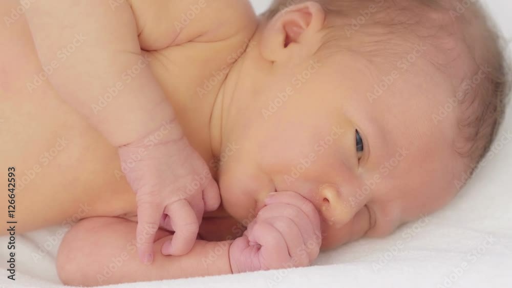 Newborn baby sleeps. Sleeping newborn baby in blanket.
Newborn baby sleeps. Sleeping newborn baby in blanket.