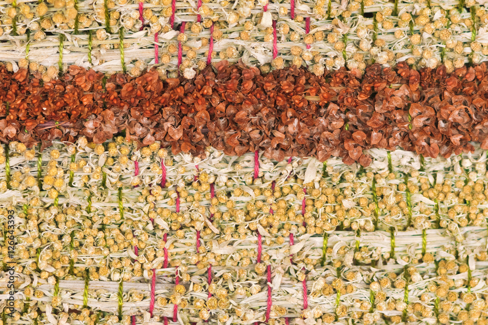 Woven panels of dried herbs, close up, background