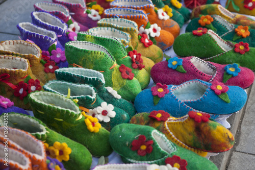 Handmade colorful wool slippers or shoes for sale at street in Tbilisi, Georgia, Europe.