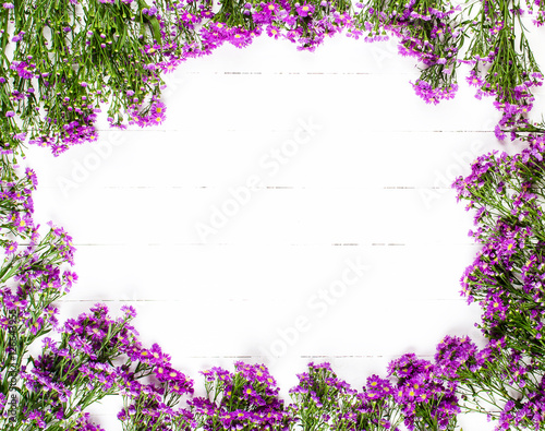 Purple flower on white table background.space background.