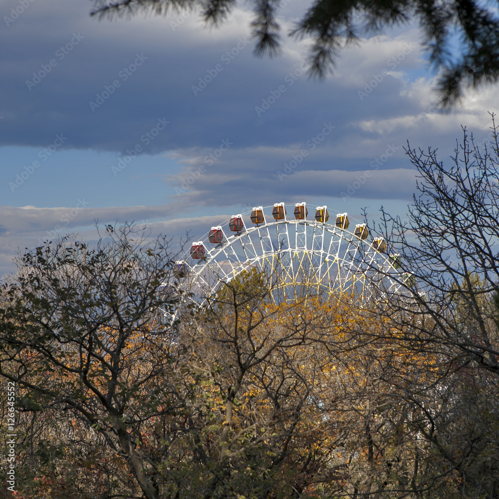 Ferris wheel in Tbilisi on bright blue sky background Ferris wheel in Tbilisi on bright blue sky background