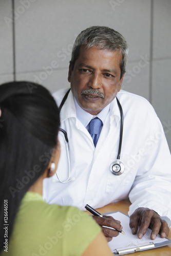 Indian doctor talking to patient
