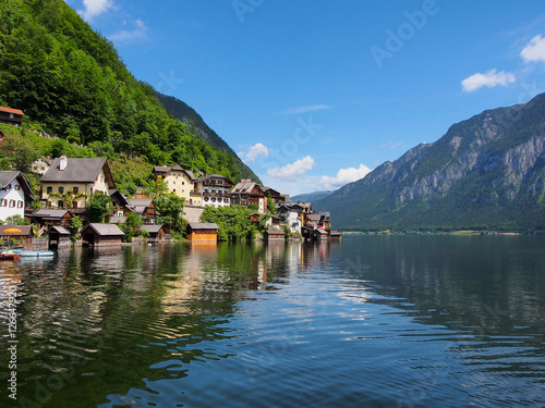 Hallstatt village and alpine lake in sunny day. Austrian Alps