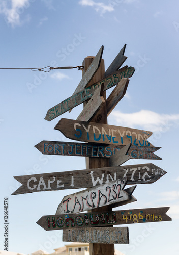 Rustic wooden signpost to various destinations at Fort Zachary, photo