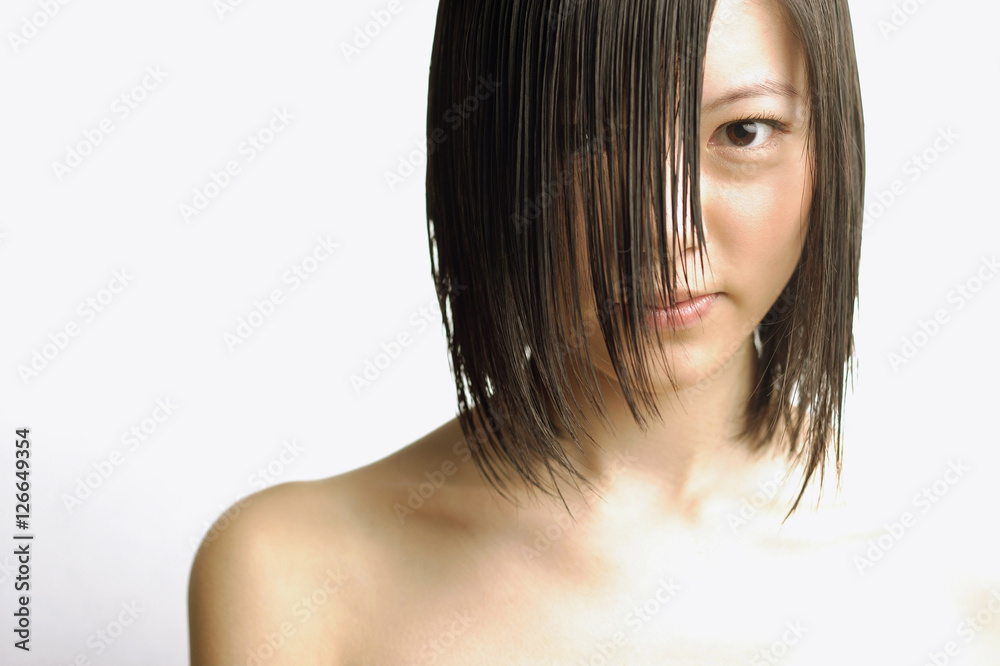 Fototapeta premium Young woman with wet hair, head shot