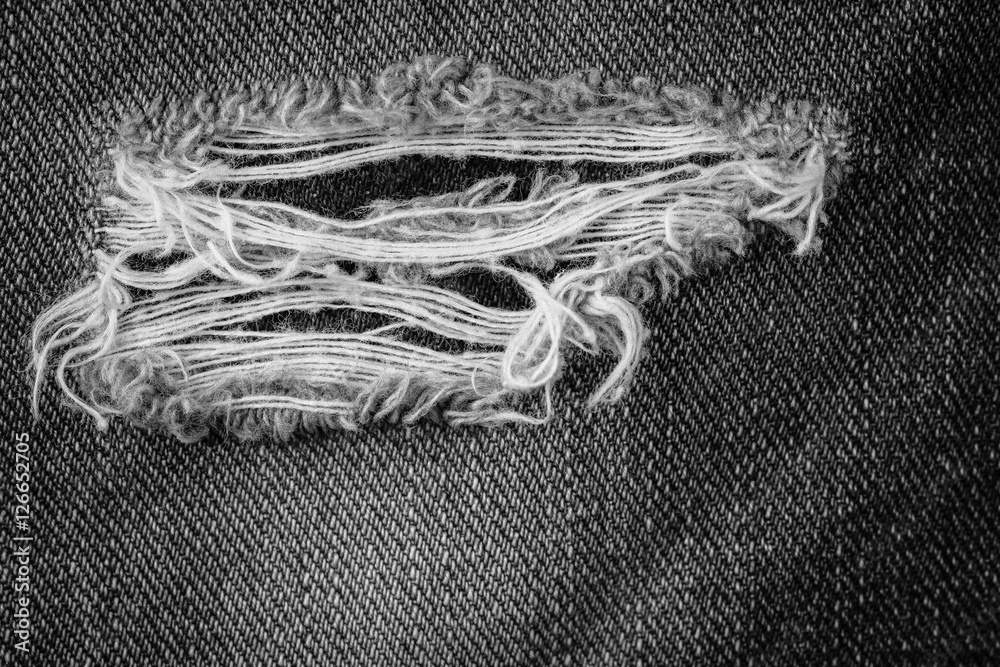 Black torn denim texture. Stock Photo | Adobe Stock