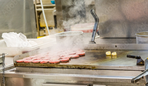 фотографія Burgers Smoking on Griddle
