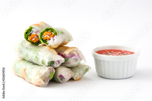 Vietnamese rolls with vegetables, rice noodles and prawns with sweet chili sauce isolated on white background

