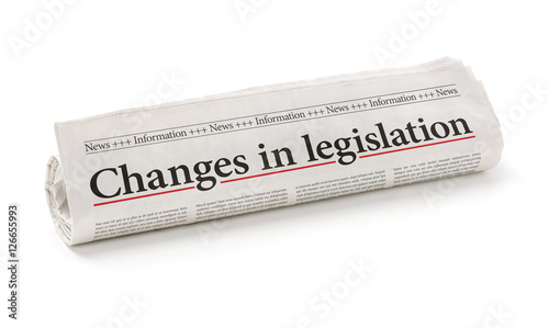 Rolled newspaper with the headline Changes in legislation photo