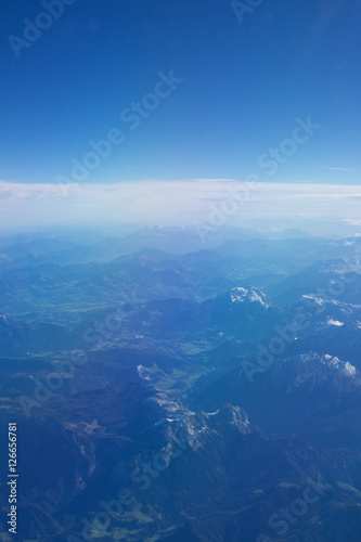 AUSTRIA - October 2016: The alps as seen from an airplane, plane view of mountains.