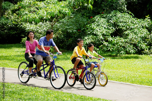 Family in park, cycling