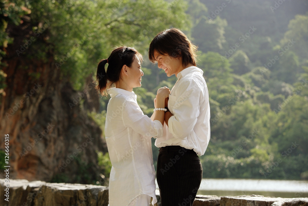 Couple holding hands, face to face Couple holding hands, face to face