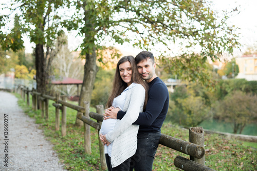 Happy and young pregnant couple 
