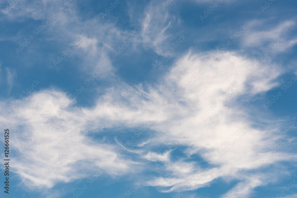 blue sky background with tiny clouds