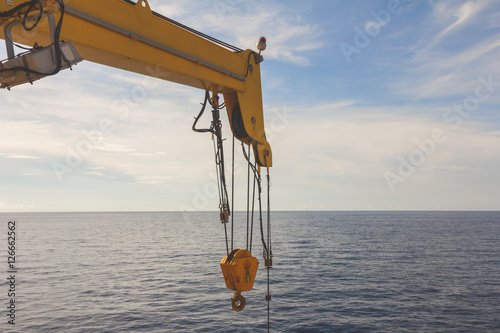 Boom crane wait for lifting in the sea offshore