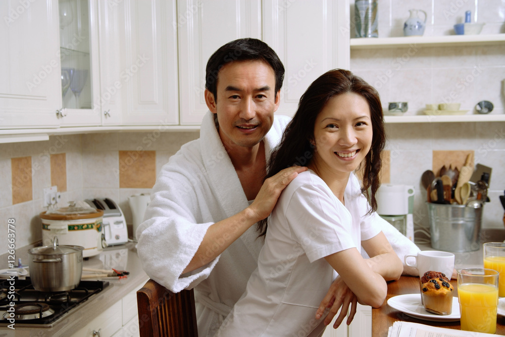custom made wallpaper toronto digitalCouple sitting in kitchen, smiling at camera
