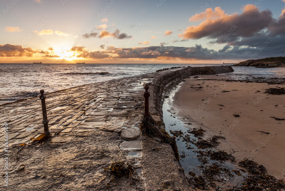 Dawn at Cullercoats Bay, North Tyneside, Engalnd, UK. From North Pier looking southward.