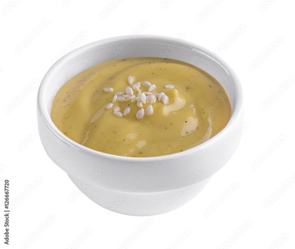 salad dressing in white bowl on white background salad dressing in white bowl on white background