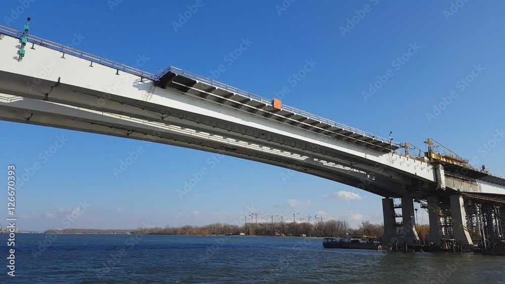 Construction of the bridge across the river. Steadicam shot. Construction of the bridge across the river. Steadicam shot.