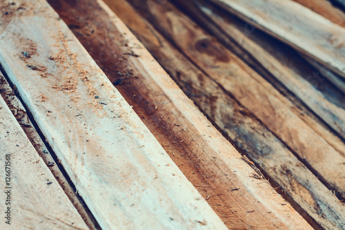 Large stack of wood planks