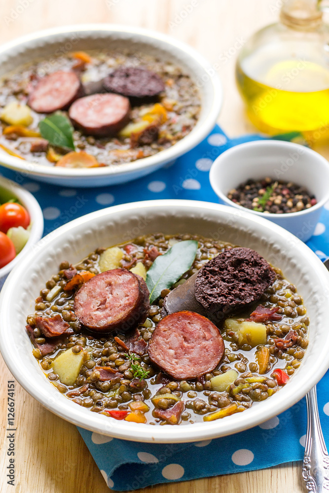 Lentil stew with carrots, potato, bell pepper and sausages Lentil stew with carrots, potato, bell pepper and sausages