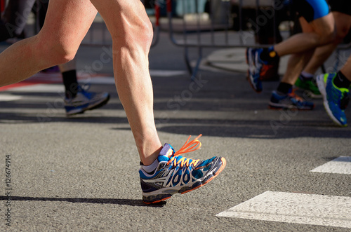 Marathon running race, people feet on road, sport, fitness and healthy lifestyle concept 