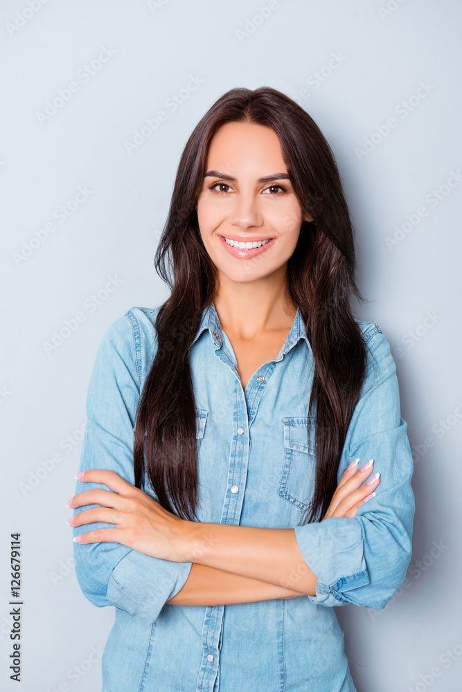 Portrait of beautiful woman with beaming smile with crossed hand Portrait of beautiful woman with beaming smile with crossed hand