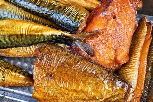 Set of smoked fish in a tin pan