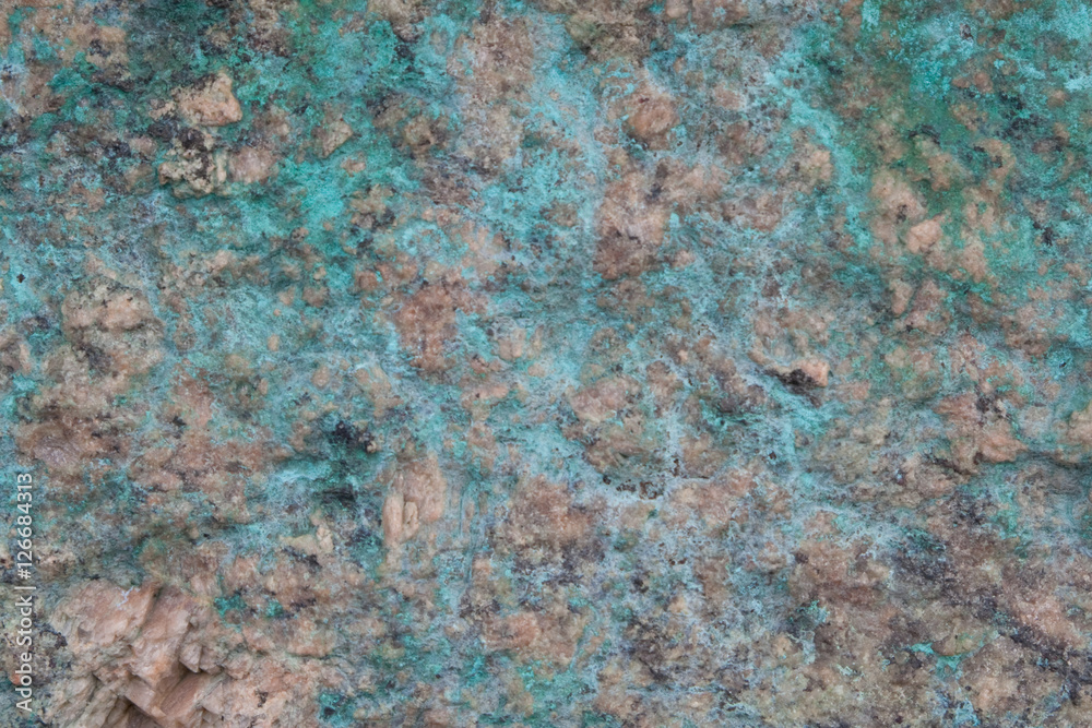 Copper green running on natural marble